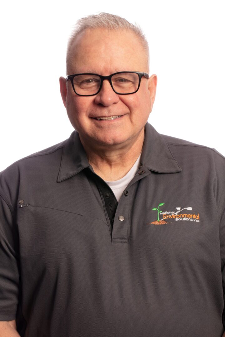 A man wearing glasses and a black shirt